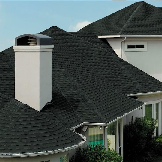 Large white home with black GAF roof