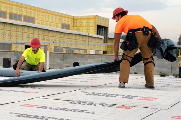 GAF certified contractors rolling out the new roof.