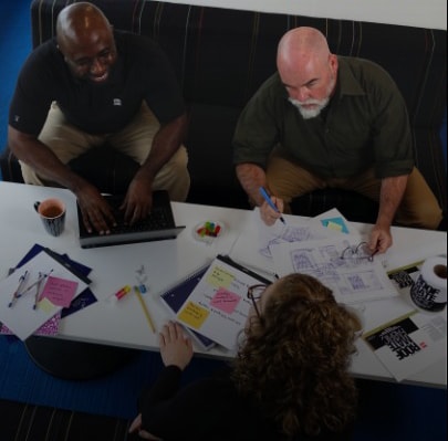 GAF employees collaborating around table