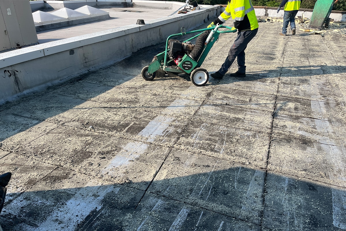 GAF certified roofing contractors preparing The New Interdisciplinary School roof for new materials