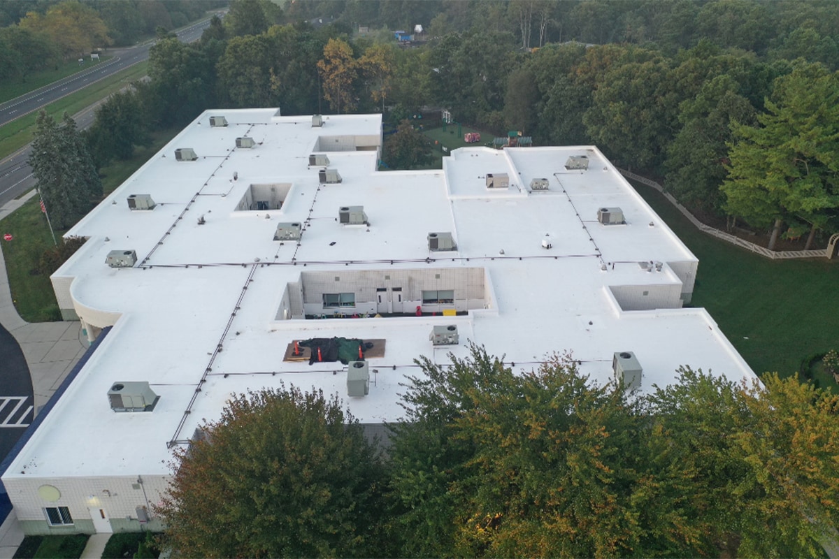 Aerial view of completed school rooftop using GAF commercial roofing system