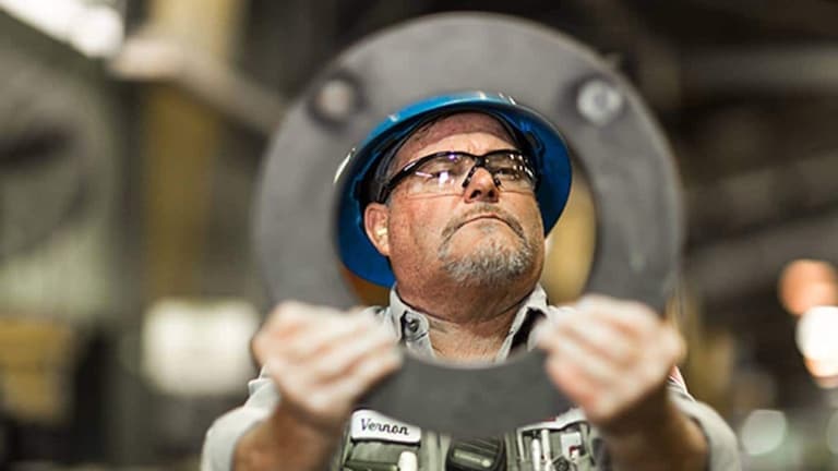 GAF roofing employee holding circular material with his face in frame