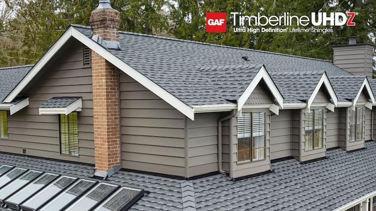 Beauty shot of gray home with UHDZ Pewter Gray shingles.