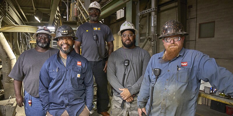 GAF employees working in American manufacturing plant