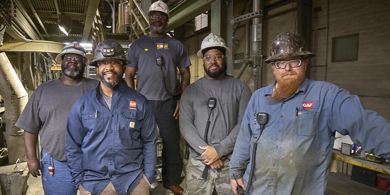 GAF employees working in American manufacturing plant