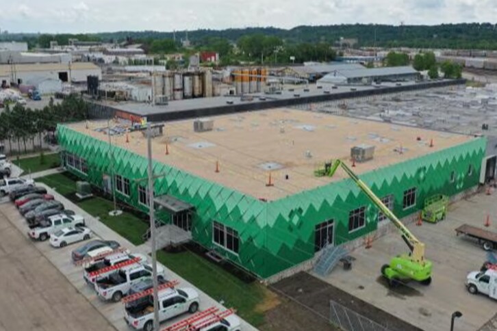 Delta Innovative Services roofing contractors working on a roof replacement project