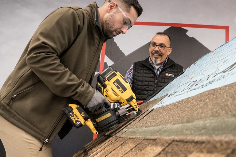 Residential roofer training with nail gun at GAF CARE contractor training center 